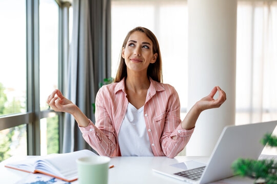Person meditating and practicing self-regulation Person meditating and practicing self-regulation