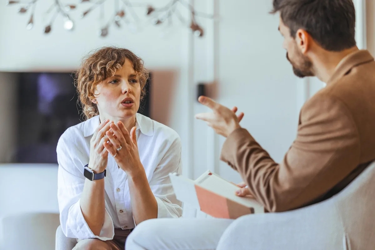 Two people having a calm face-to-face difficult conversation