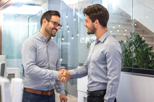 benefit from relationships Professionals building trust through a strong business relationship