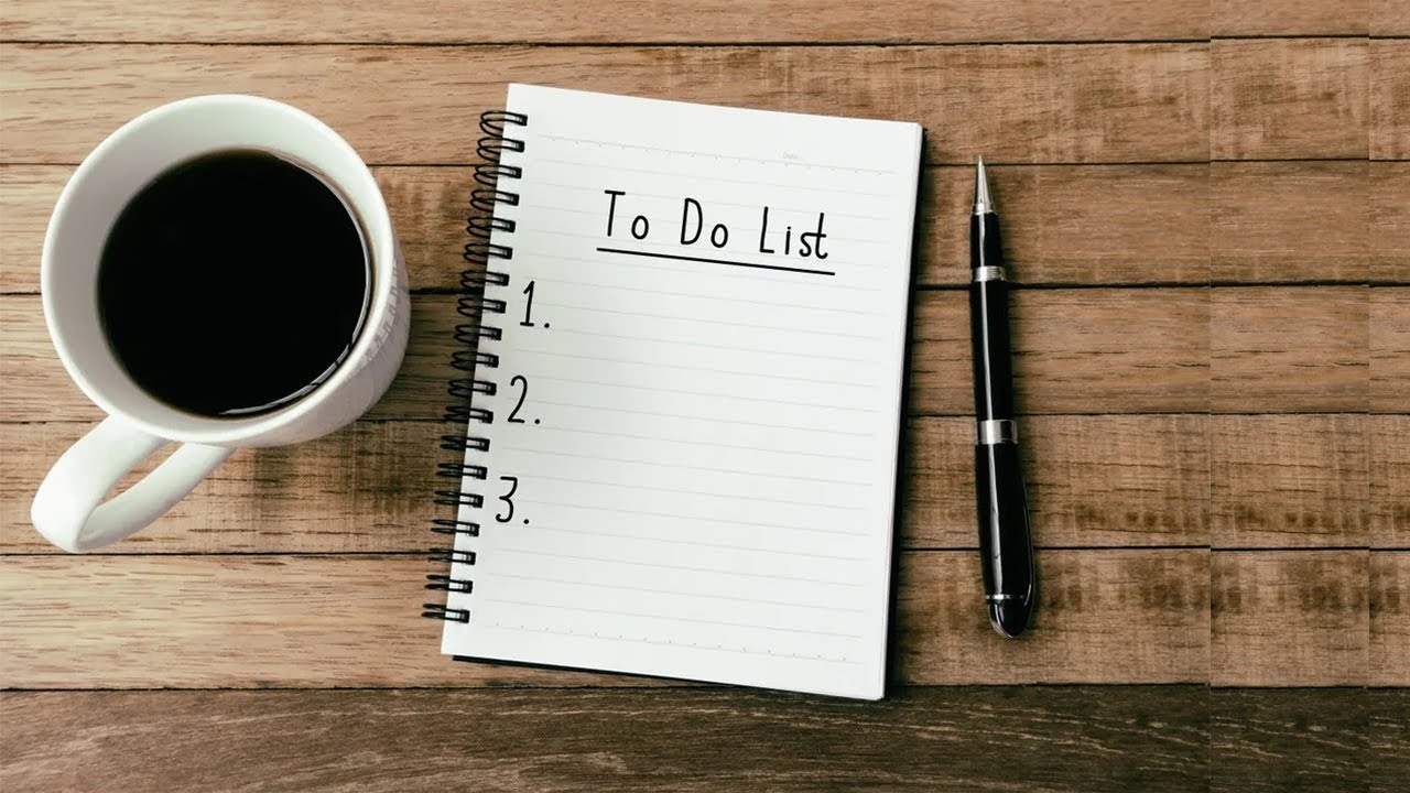 daily to-do list A person tracking progress by checking tasks off a productive daily to-do list without stress.