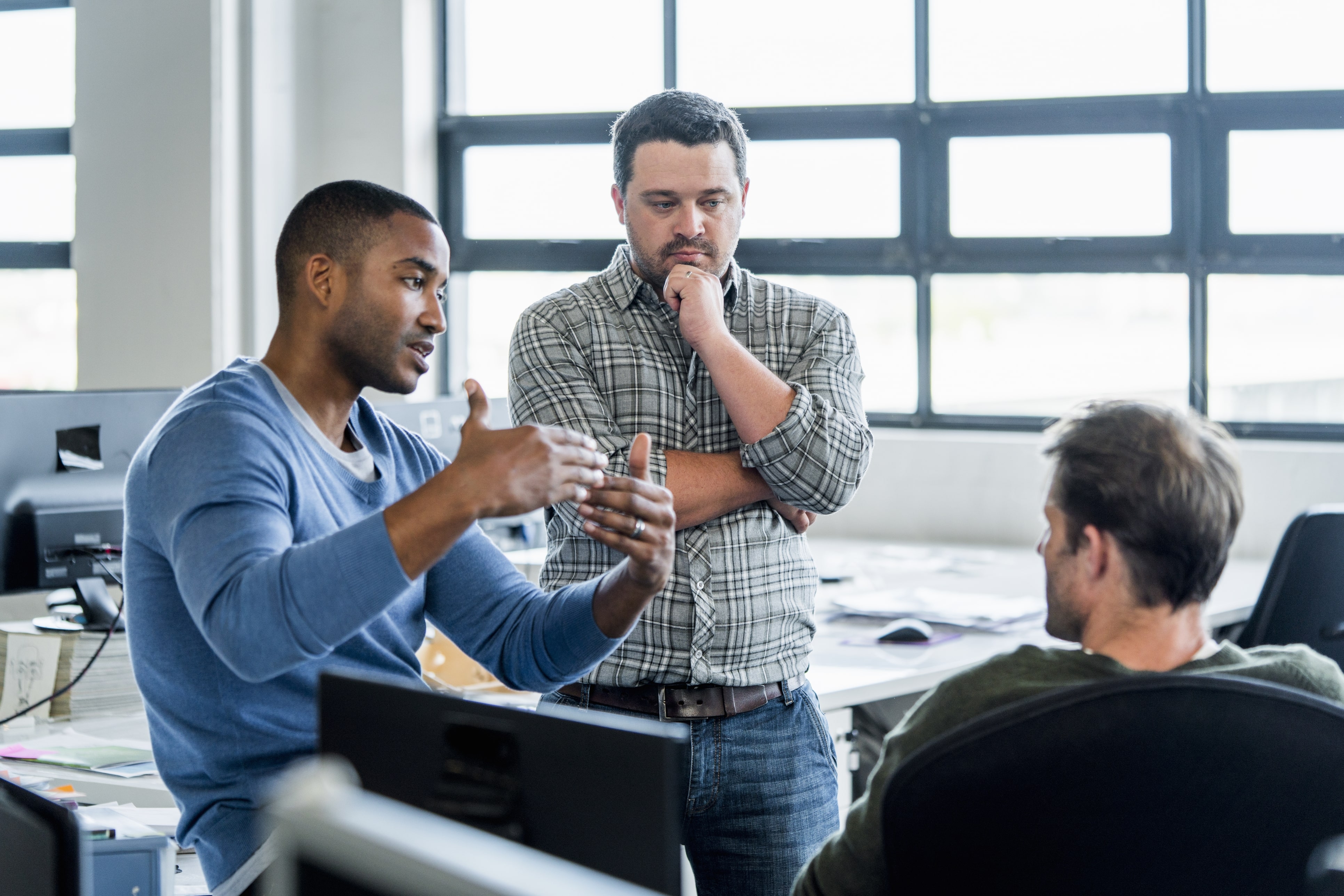 Two people reacting differently to workplace stress showing the power of a resilient positive mindset